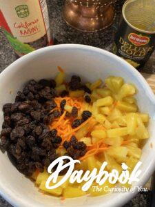 carrots raisins and pineapple in a bowl