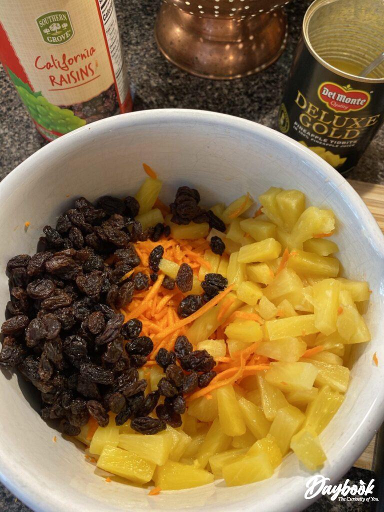 carrots raisins and pineapple in a bowl