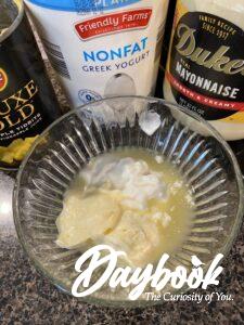 yogurt, mayonnaise, and pineapple juice in a bowl