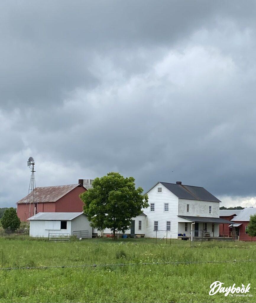 Amish farm with white house and red barn