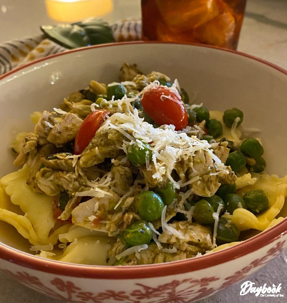 chicken, vegetables, and pasta in a bowl