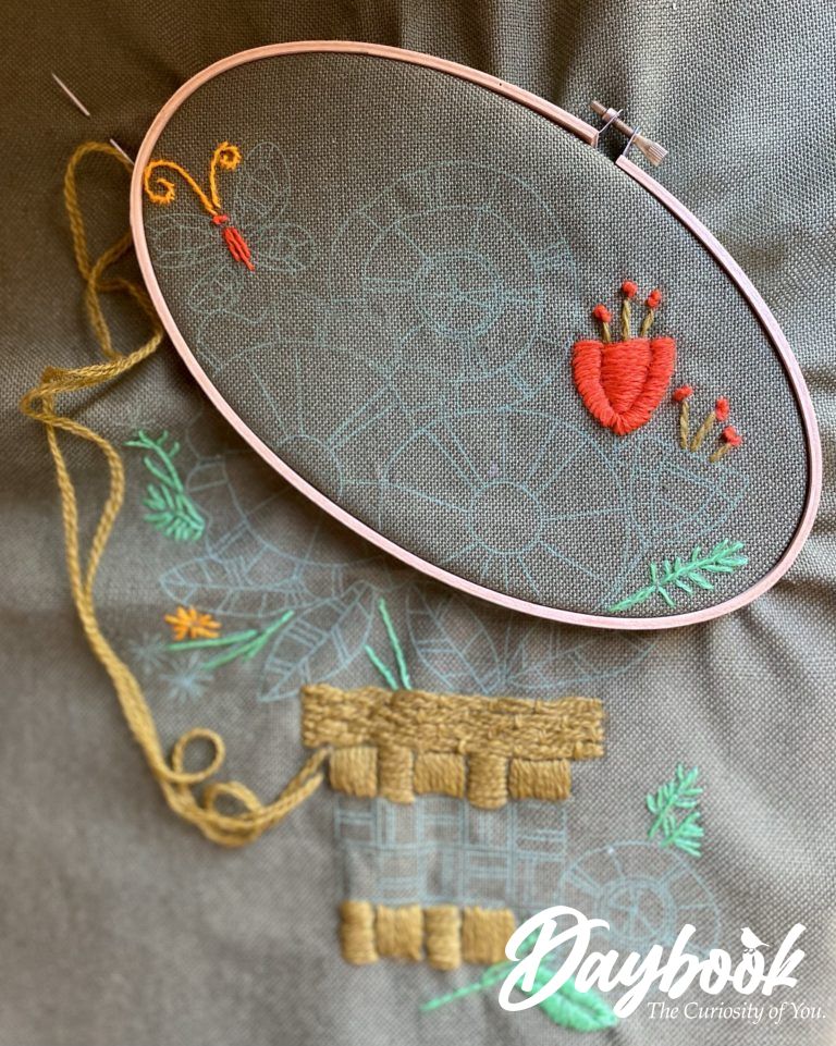 crewel embroidery piece with wooden hoop