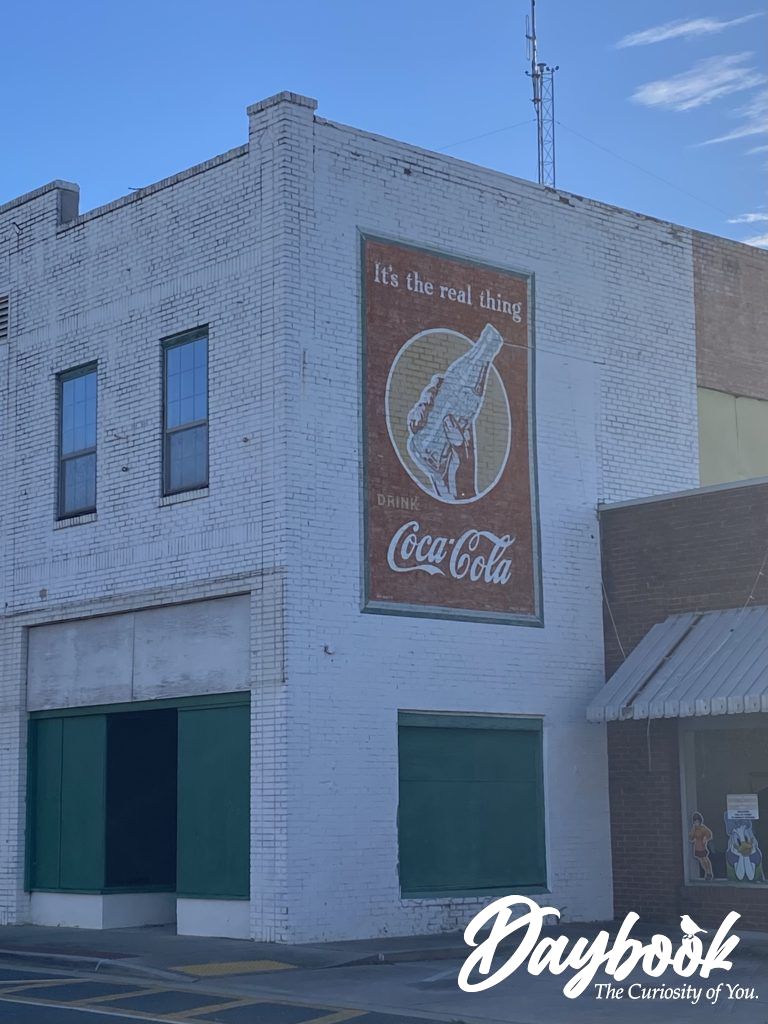 Old Coke sign painted on building