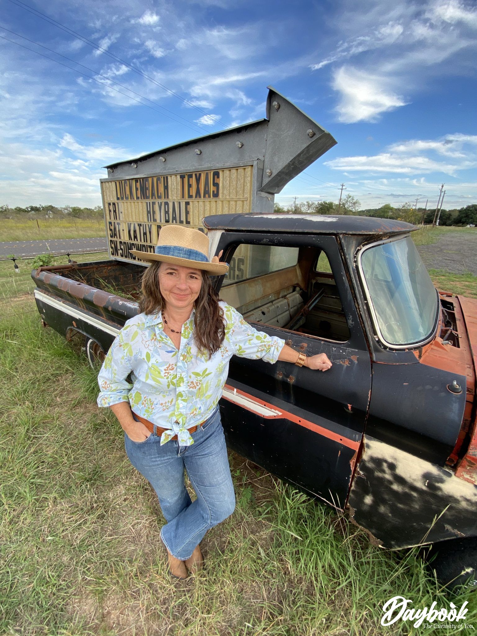 Lady in front of an old truck in Luckenbach, Texas
