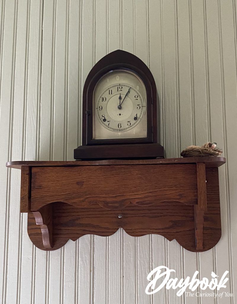 Antinque wooden clock on a shelf