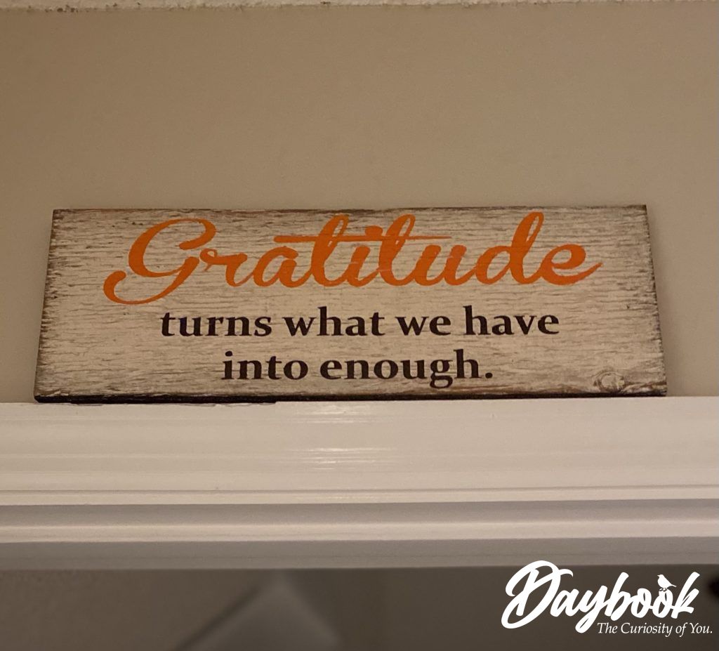 Gratitude sign above a doorway
