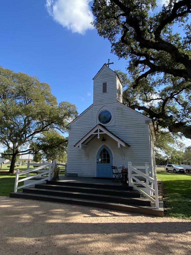A historical white church in Roundtop Texas
