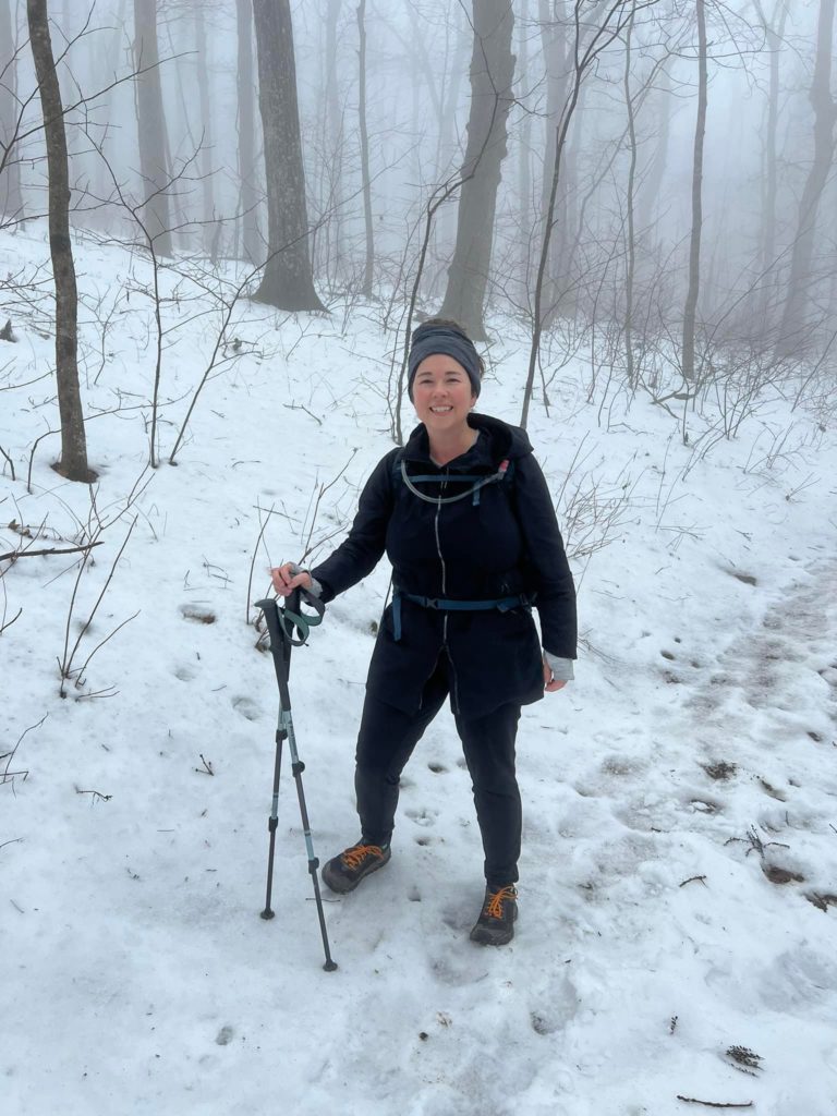 Jill posing for a picture while hiking in the snow near Amicalola Falls.