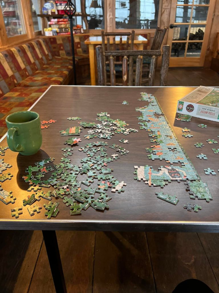 A jigsaw puzzle being completed in a lodge near Amicalola Falls