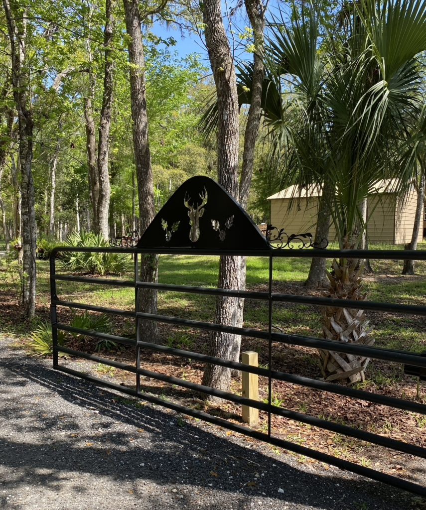 A wrought iron gate at the entrance of The Potter's Barn