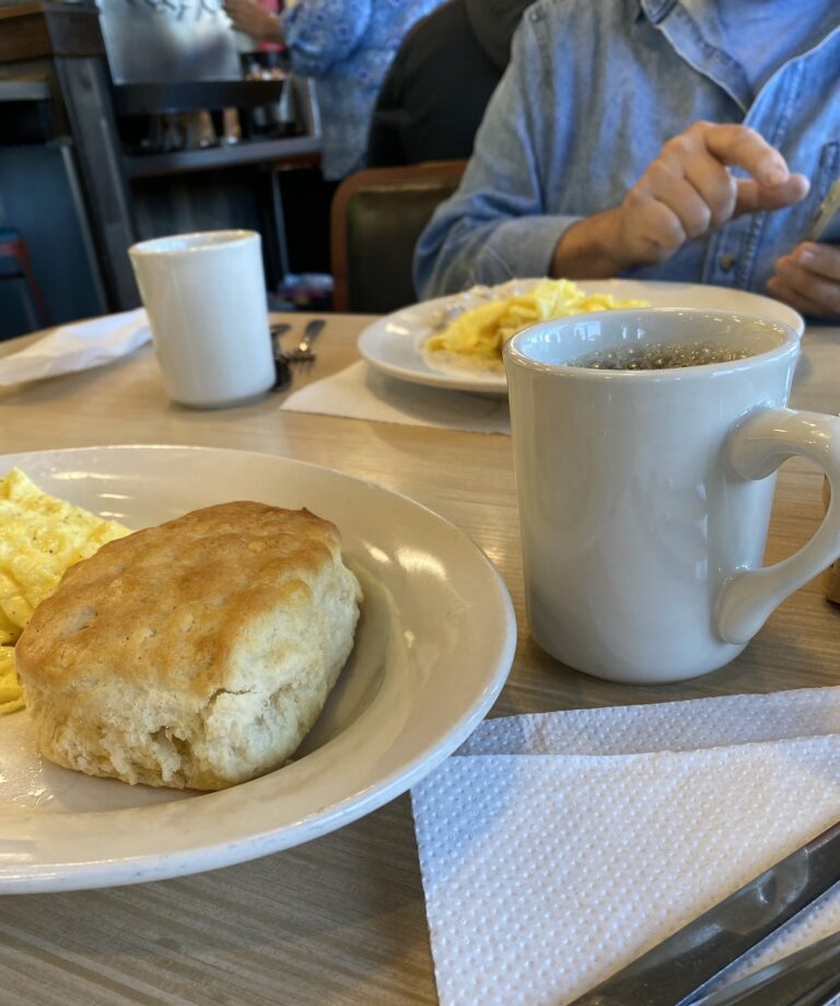 Biscuits and coffee on a table in a diner