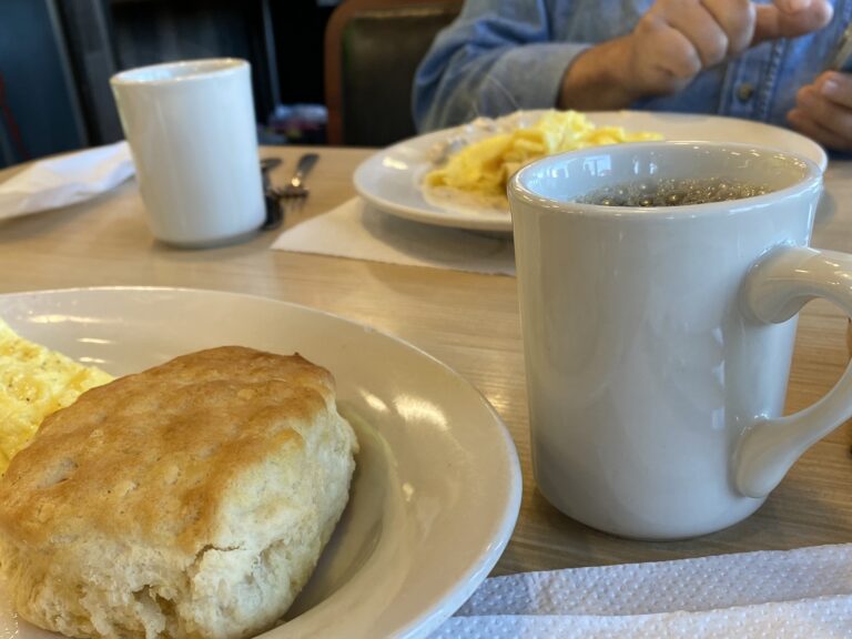 Biscuits and coffee on a table in a diner