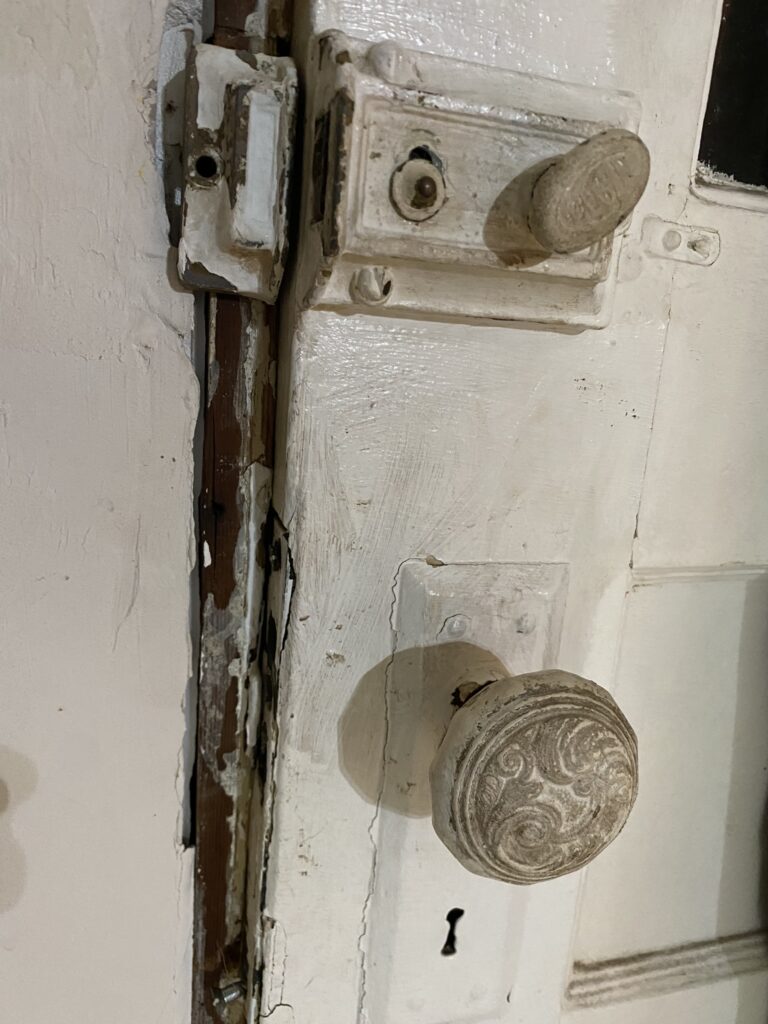 An up close picture of an antique door knob on a Florida house