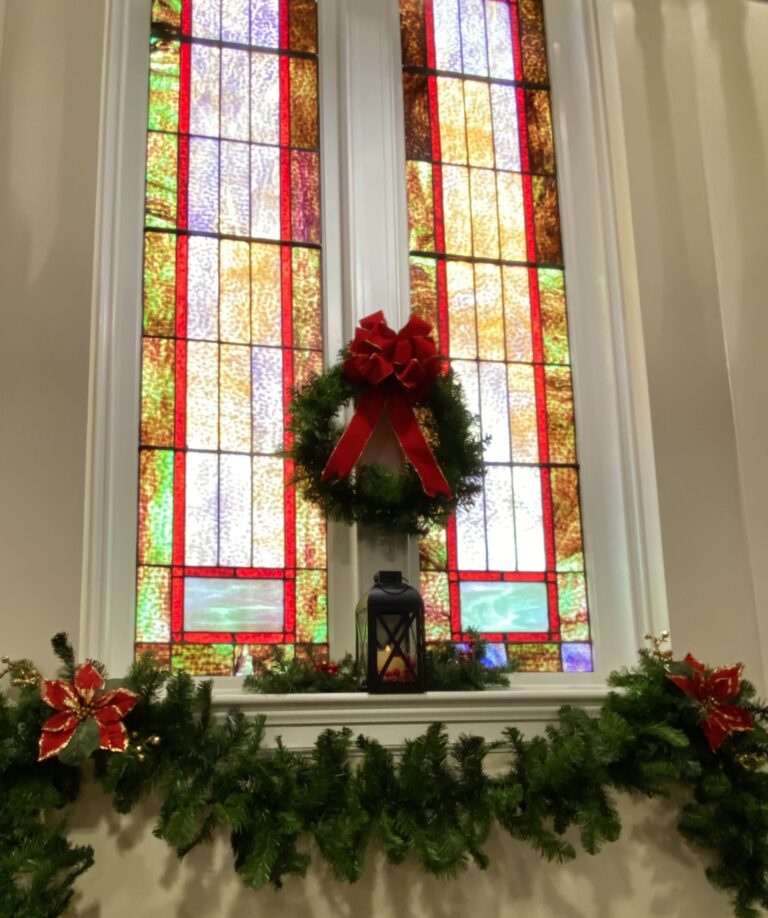 Two stained glass windows in a church on the first day of advent hope