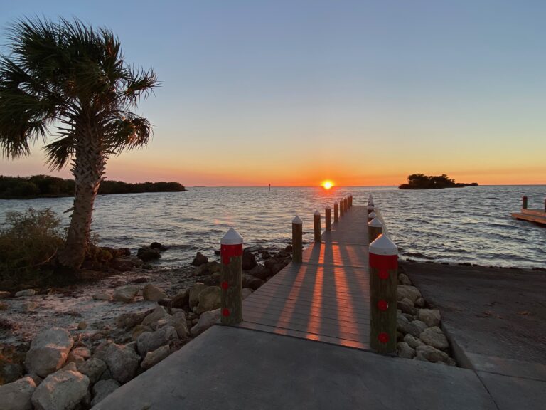 sunset over the Gulf of Mexico at a boat ramp in Florida