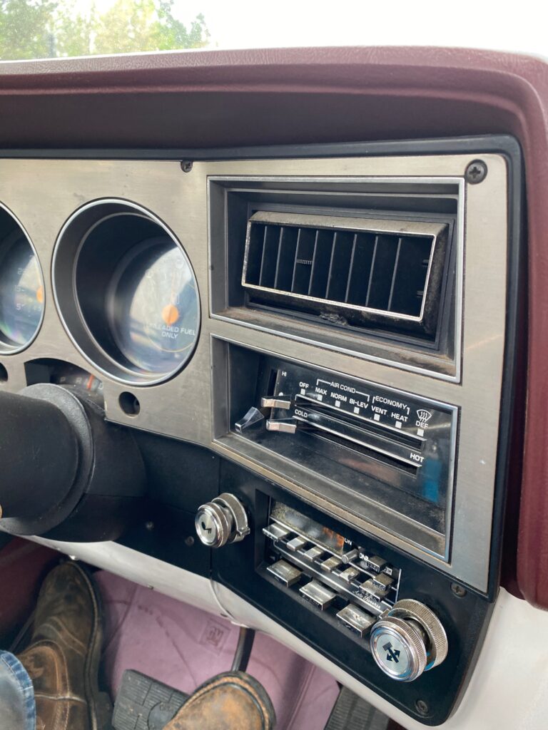 The dashboard of a 70s Chevy Silverado